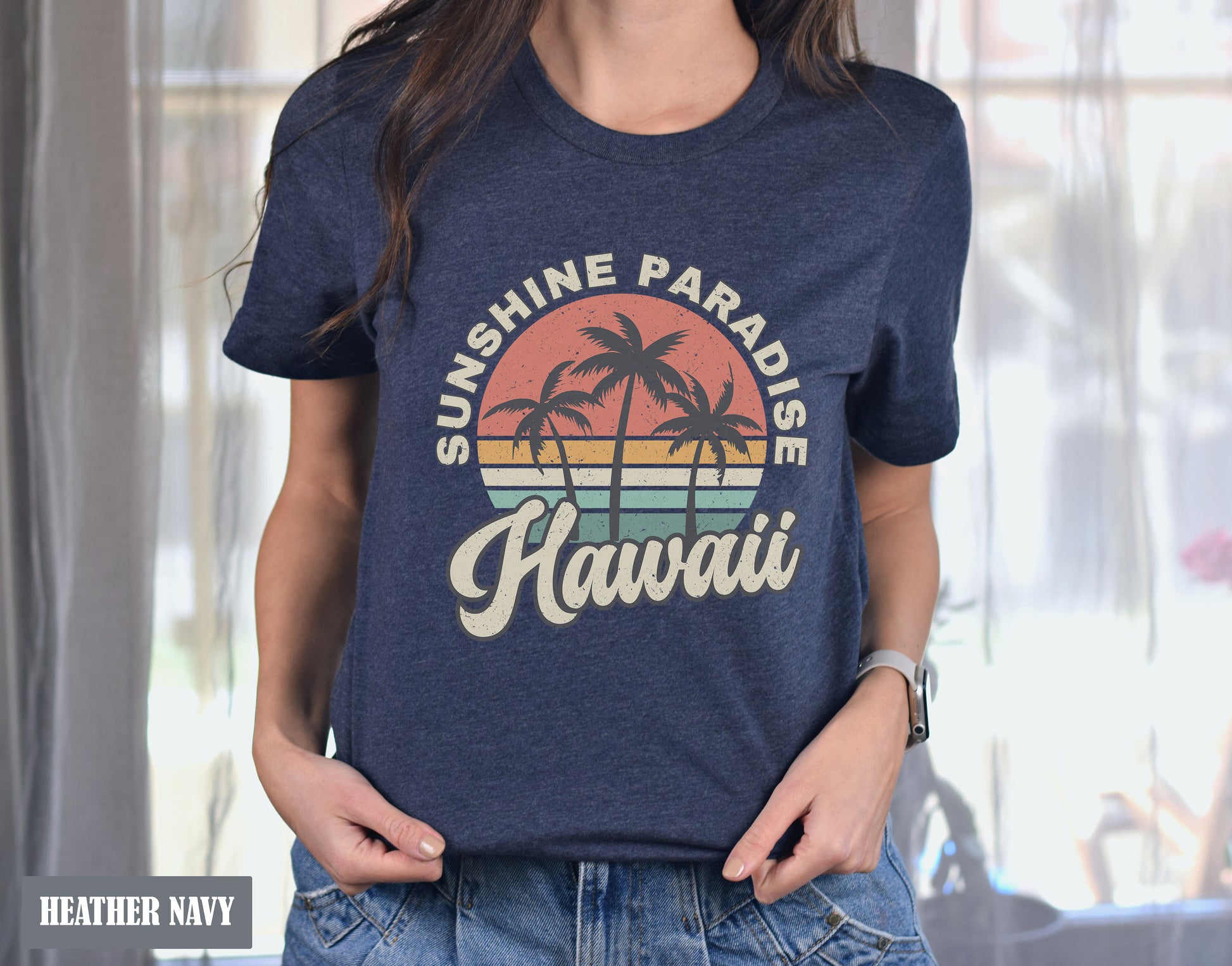 a woman standing in front of a window wearing a shirt that says sunshine paradise hawaii