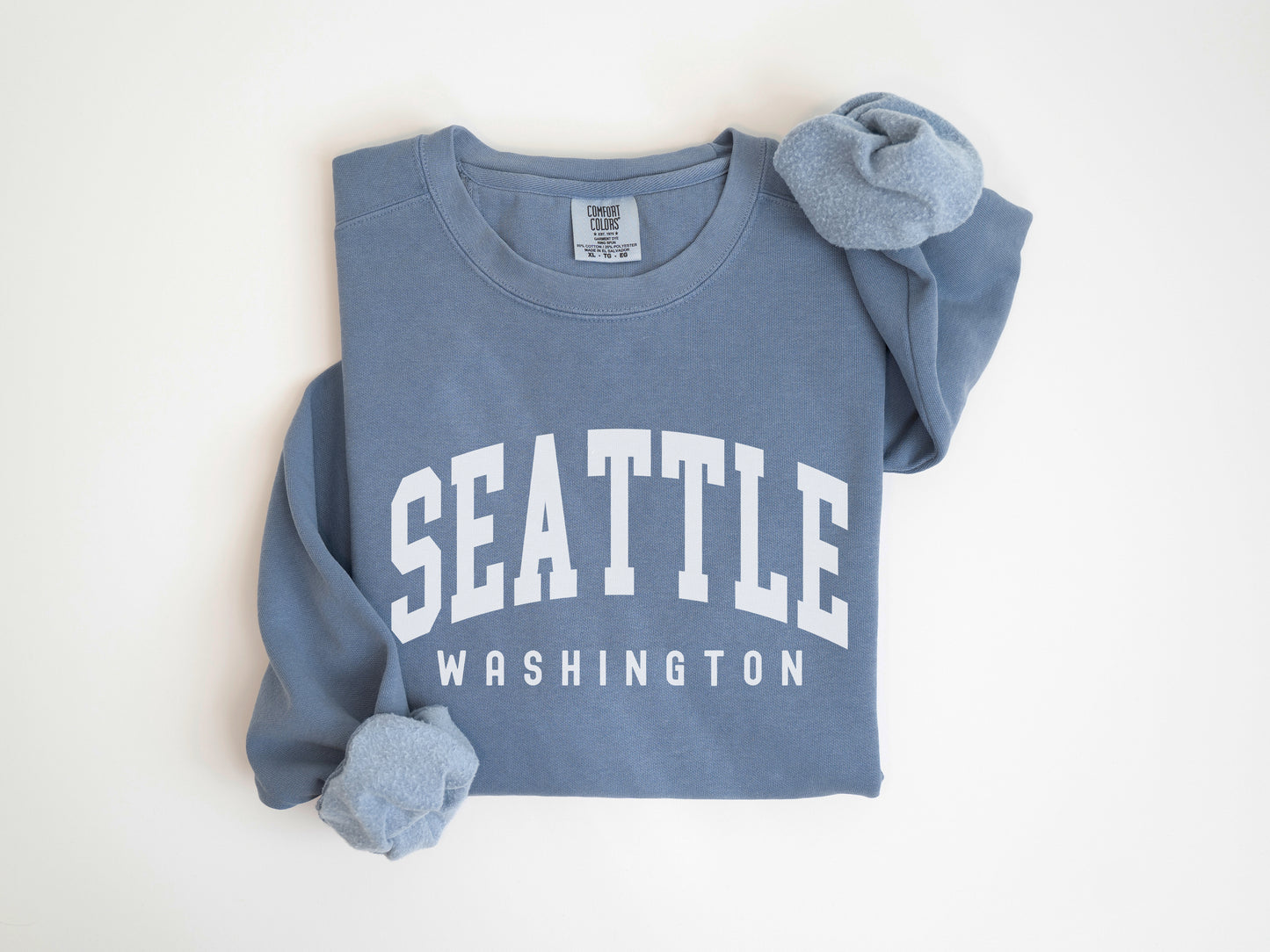 a blue sweatshirt with the word seattle on it