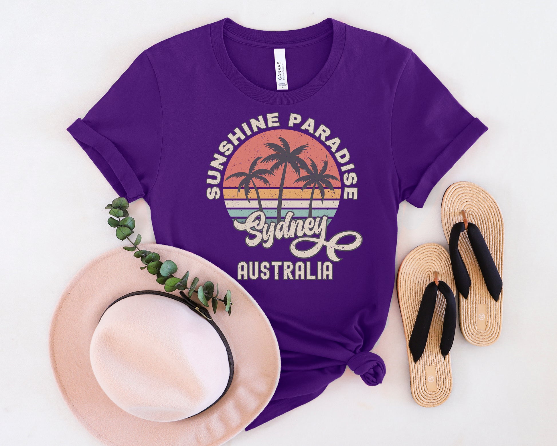 a purple shirt with the words sunshine paradise sydney on it