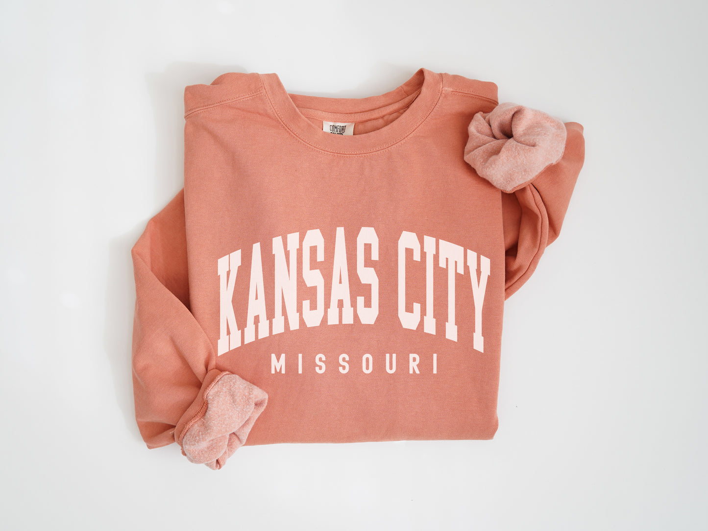 a pink sweatshirt with kansas city on it